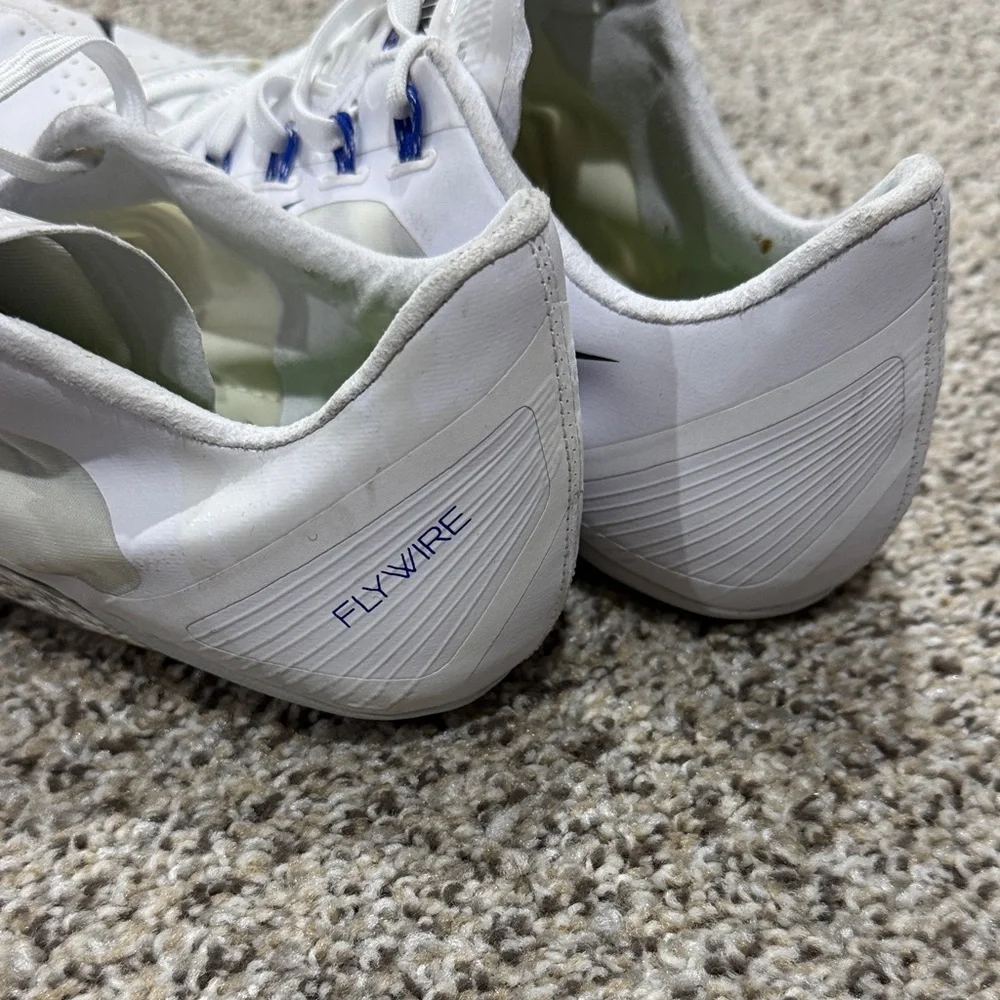 Nike fly wire White Track Spikes with Black Swoosh and Blue Accents